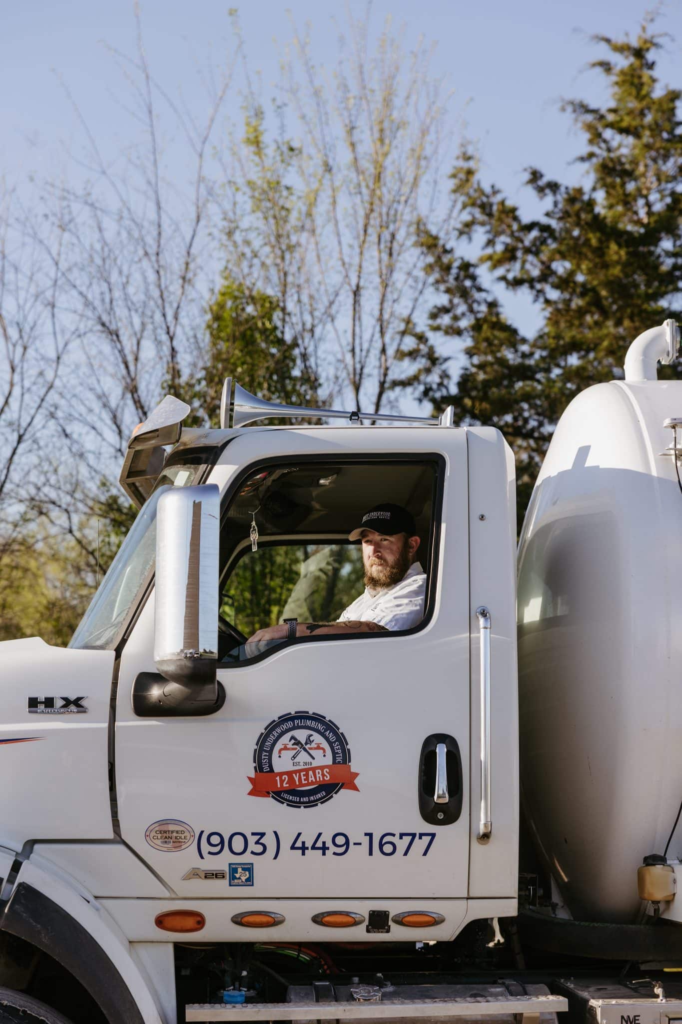 One of Underwood Plumbing’s skilled technicians pulling up in his truck for emergency septic repairs.