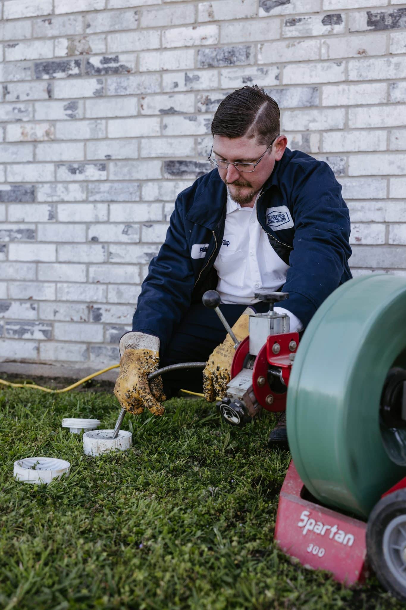 A plumber in Texas from Dusty Underwood Plumbing working on summer plumbing problerms.